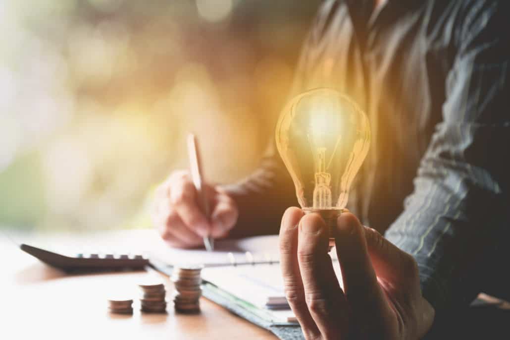 professional holding lightbulb