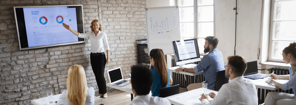 Woman giving a powerpoint presentation live.