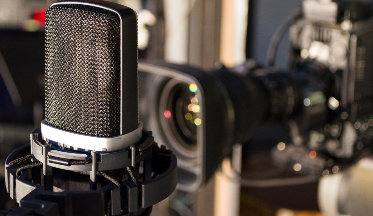 Retro microphone on stage a background of studio camera