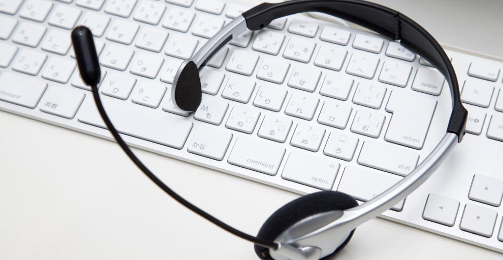 White keyboard with headset.